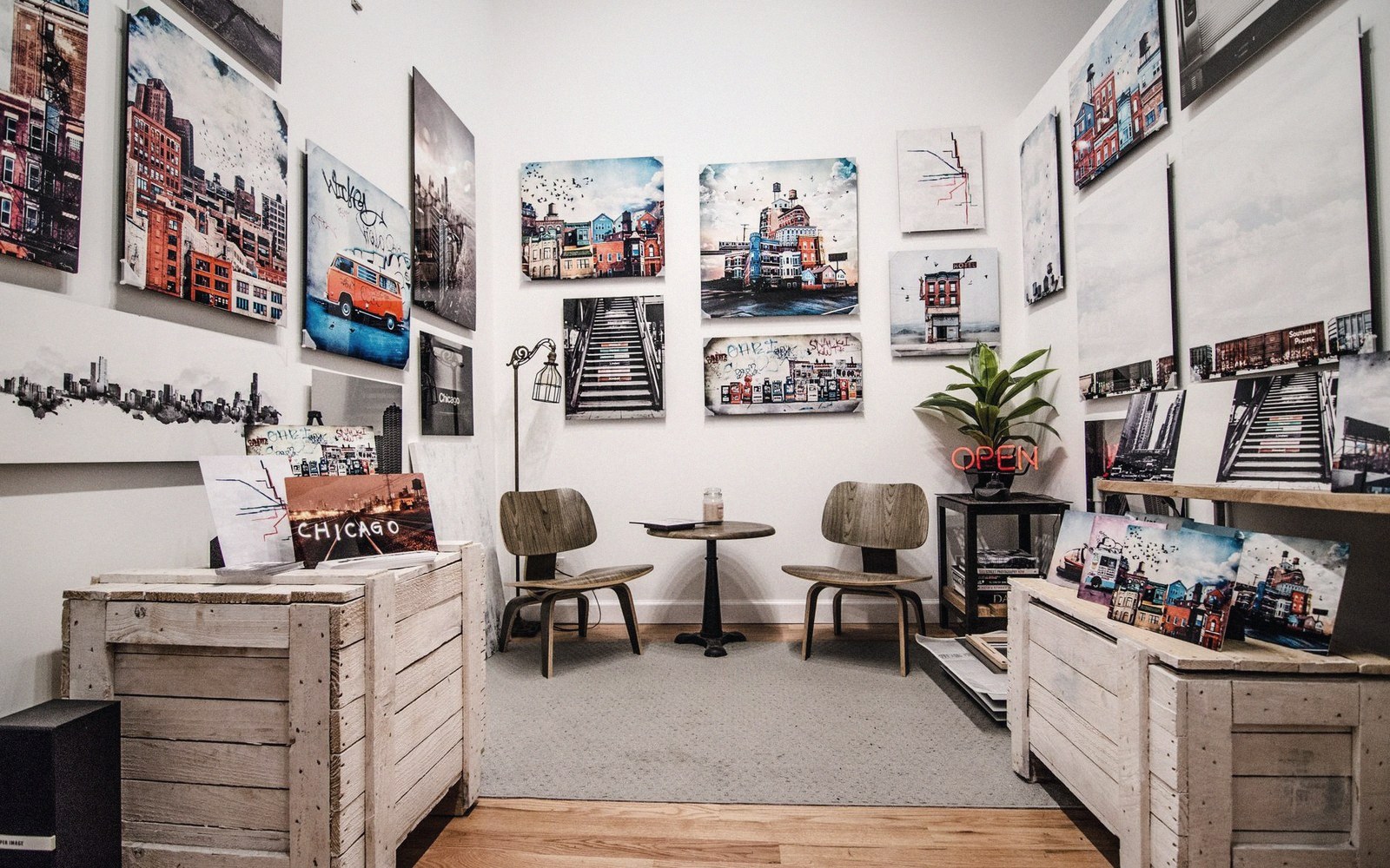 A wooden art crate and travel frame open on a gallery floor